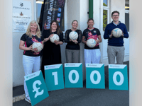 Teignmouth netball team scores developer donation