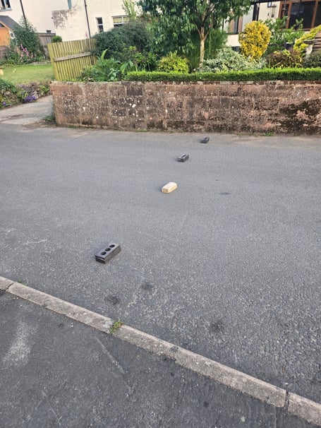 Bricks placed in the road at Milbury Close Exminster. Photo Luke Smith 