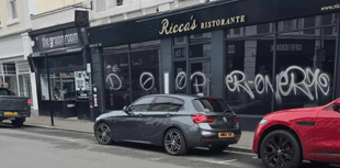 Police appeal for witnesses over shop window graffiti 