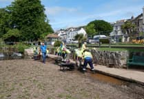Dawlish volunteers clear waterway sediment
