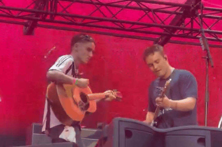Joseph, left, with Sam Fender as the duo perform 'The Borders' to 50,000 fans at St James' Park