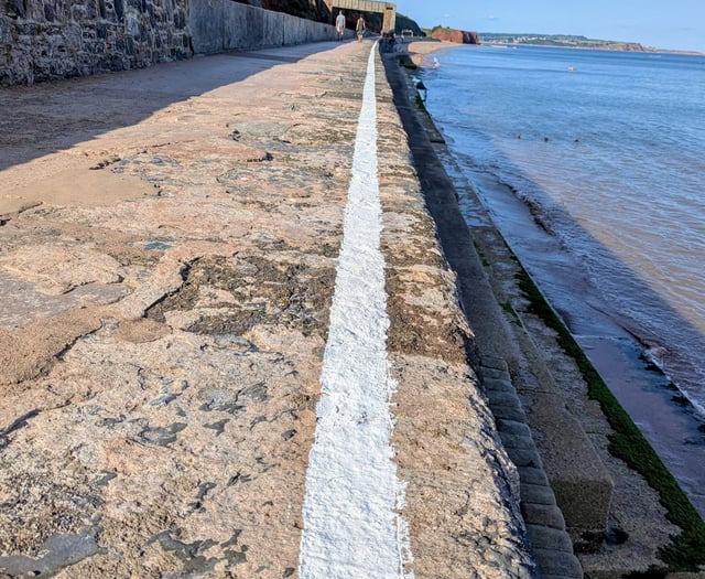 Rail company paints 'experimental' white safety line on sea wall 