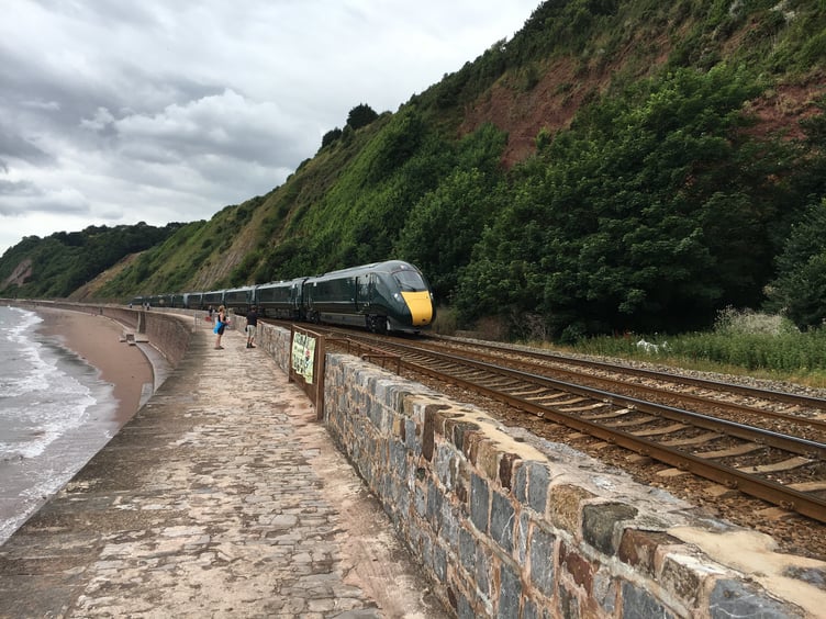 Train along the line between Dawlish and Teignmouth. Photo Network Rail