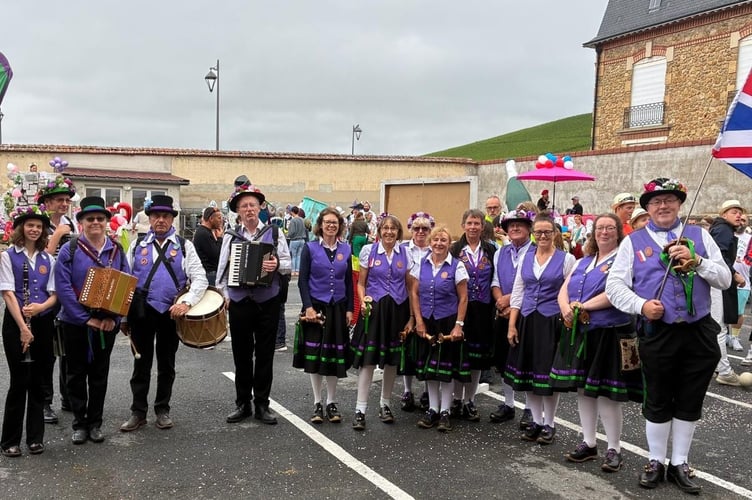 Raddon Hill Clog Morris members awaiting the start of the grand procession in France. 