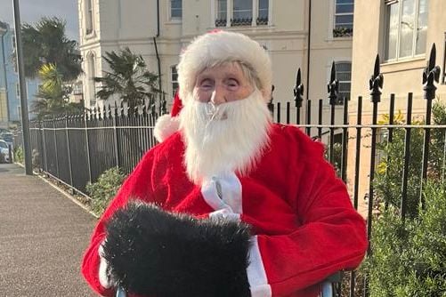 Joan Aplin dressed as Father Christmas.