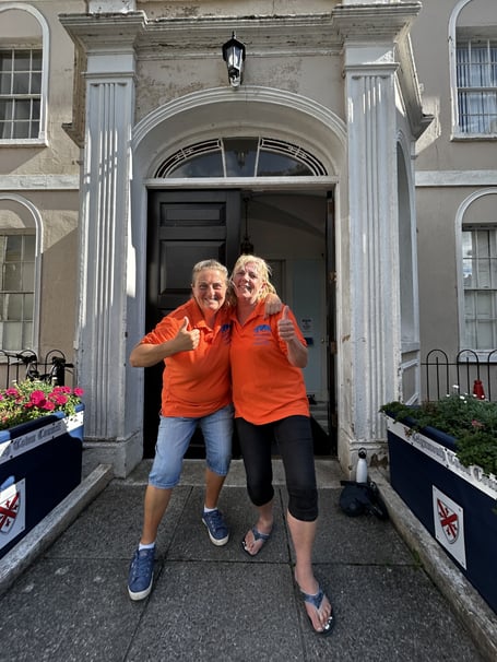 Sarah Woolway, left, and Cathy Hooper celebrating the grant outside the Town Council HQ at Bitton House. Photo Nigel Canham 
