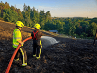 Fire crew help save tree after compost heap sparks field fire 