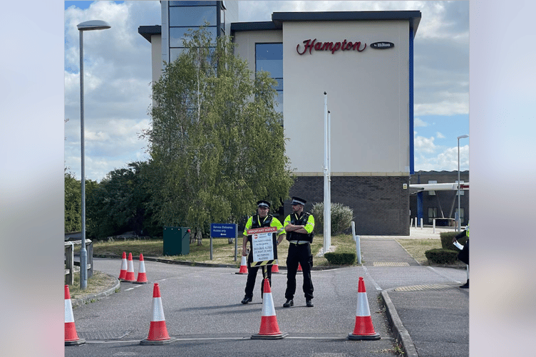 Police at an Exeter migrant hotel protest