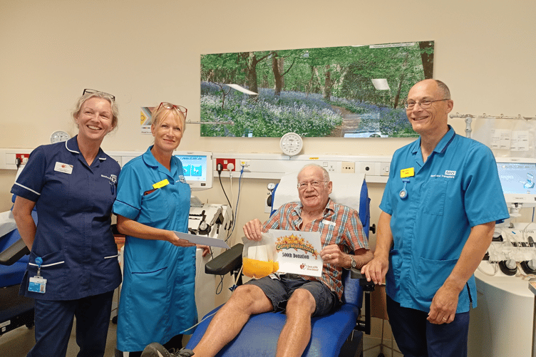 John Jerwood with some of the team as he makes his 500th donation