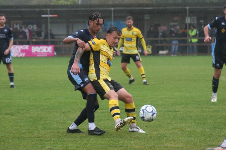 Buckland midfielder Sean Thomson in possession