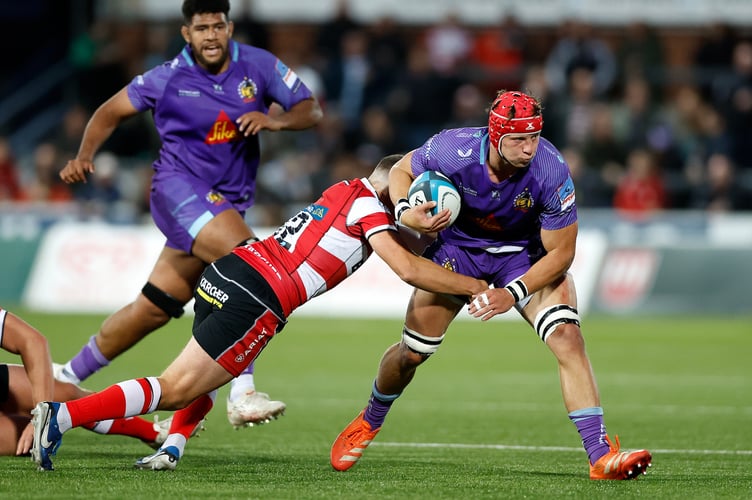 Exeter Chiefs No.8 Ross Vintcent takes on the Gloucester defence during their Premiership Rugby Cup clash at Kingsholm