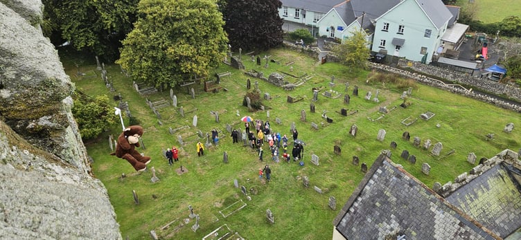 Monkey launches down the wire at Teddy Tower Day at St Michael's Church, Ilsington.