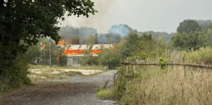 Fire near pond prompts emergency service response