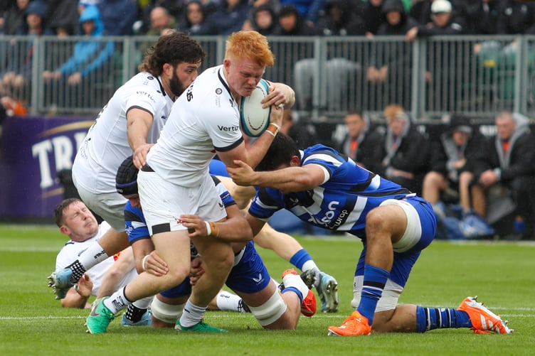 Exeter Chiefs centre Ben Hammersley looks to shake off the attentions of Bath's Thompson Cowan at The Rec