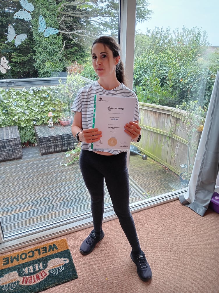 Zoe Jones, a senior support worker at The Holt, with her certificate.