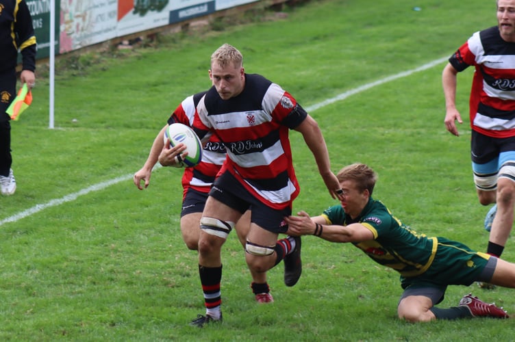 Captain Cam Johns storming in for his try