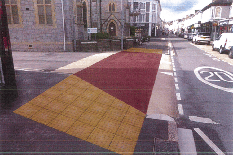 An artist's impression of the planned coloured surface and tactile paving