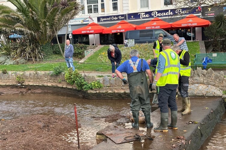 WADE volunteers in Dawlish preparing for Storm Benjamin opening weir gates. Photo Noreen Goodchild