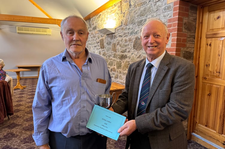 Bill Tonkin won the Devon County Ploughing Association Semi-Digger trophy, presented by President Raymond Govier.  AQ 7121
