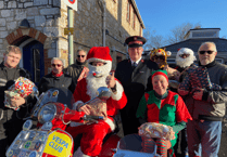 Santa delivers gifts by scooter to Newton Abbot's Salvation Army