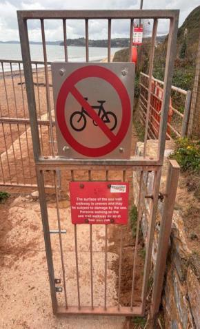 New signage prohibiting cycling on Dawlish sea wall. Photo Network Rail