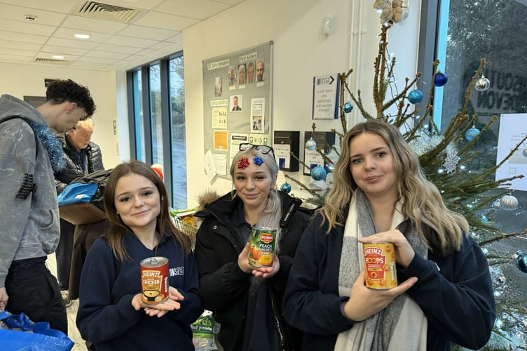 UTC students add their donations to the foodbank collection