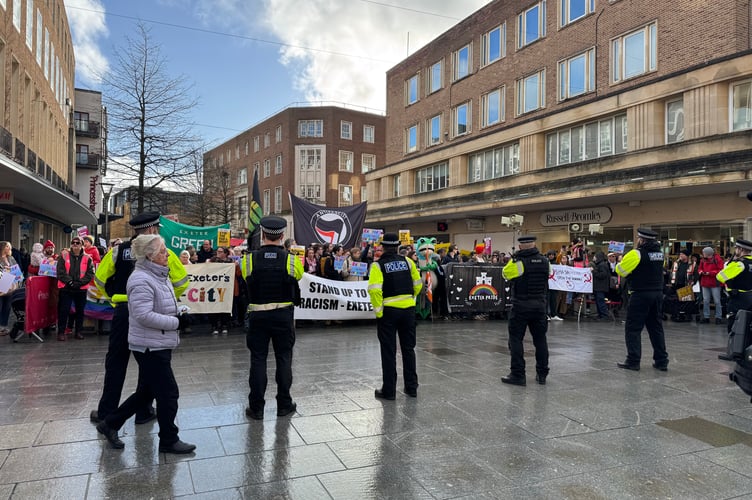 The counter-gathering by Stand up to Racism Exeter is for Everyone and police line.  AQ 2552
