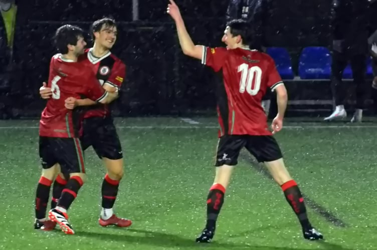 Bovey reserves celebrate in the rain against Teignmouth