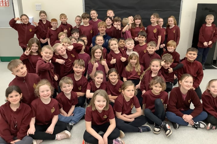 Athlete David Hill with pupils from Rydon Primary. Photo submitted 