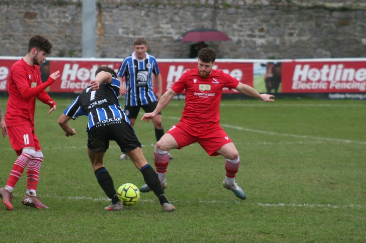 Teignmouth scorer Jack Towill in action against Spurs
