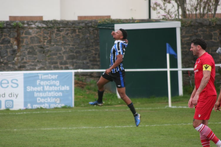 Tate Breslan-Aggrey jumps for joy after scoring Spurs' third goal against Teignmouth