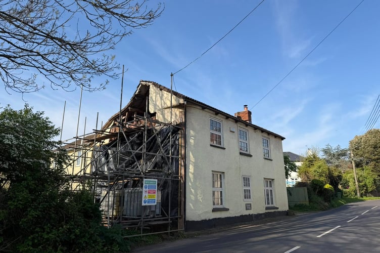 Scaffolding now supports the collapsed cob wall at Orchard Cottage, Exminster. photo contributed
