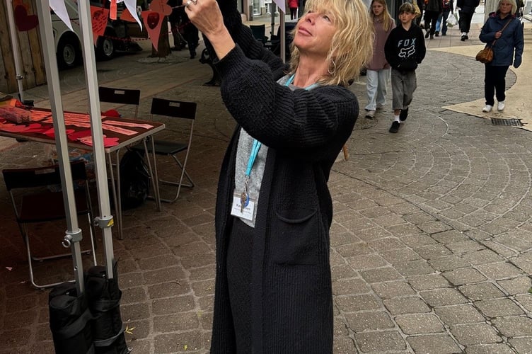Museum community engagement officer Kate Green and some of the messages from Newton Abbot residents. Photo contributed 