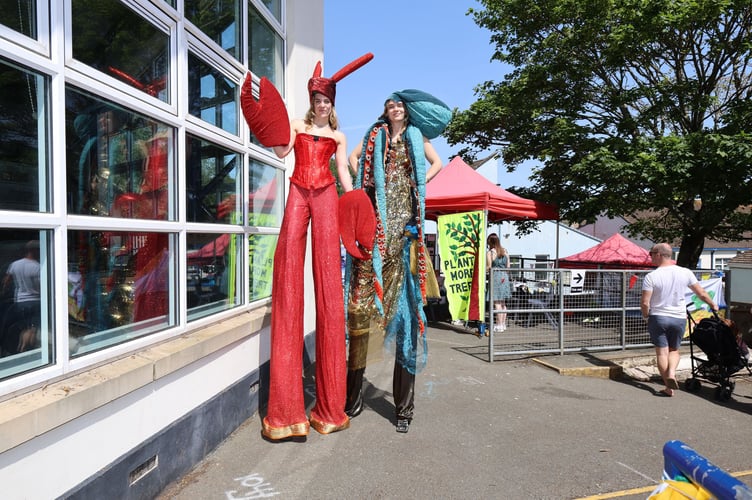 Stilt walkers at the Turn The Tide event held at Dawlish College. Photo Bob Simpson