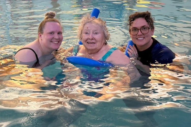Veronica Down, 85, enjoys swimming with help from care home staff. Photo contributed