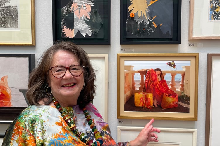 Teignmouth artist Anna Grayson with her picture, Flaming June the Bag Lady, on show at the Royal Academy's Summer Exhibition