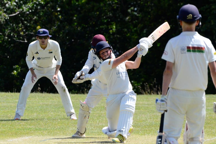 56_Josh_Couch_104_Teignmouth & Shaldon batsman Josh Couch hits out while making a top score of 39 for his side in a seven-wicket defeat by Shobrooke Park