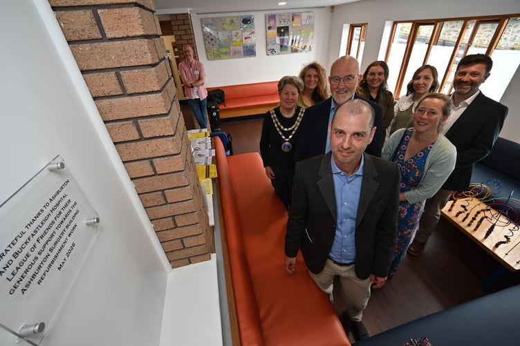 Refurbishment of Ashburton Surgery. Dr Ben Titford unveils the plaque to mark the completion of the works with A Ashburton and Buckfastleigh League of Friends chairman John Nutley