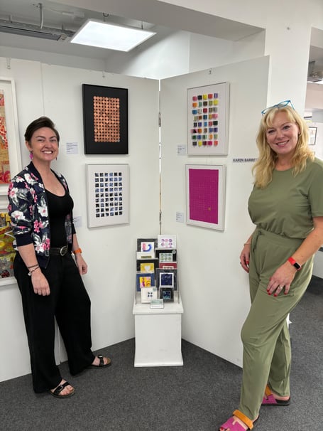 Karen Barrett, left, with her work, and fellow exhibiting artist Angela Rimmer, at the TAAG gallery, Teignmouth.