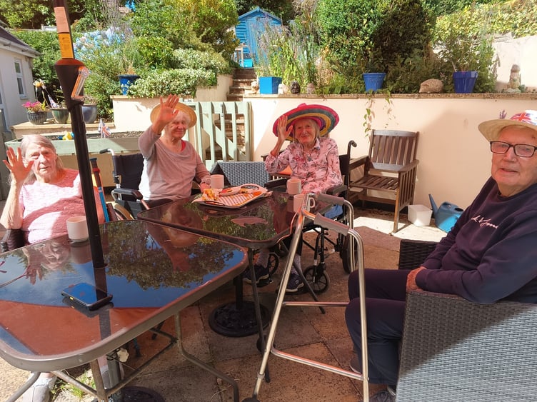 Croft Lodge care home residents in tropical headgear as they prepare for the Hawaiian celebration