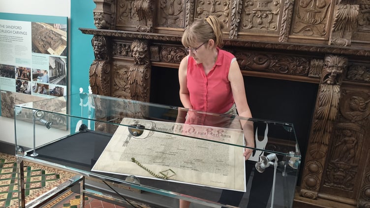 Newton Abbot Museum Assistant Lucy Cokes with a rare Tudor document. Photo supplied