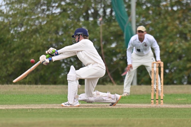Devon Cricket League C Division East.Teignmouth & Shaldon 1st XI versus Sidmouth 2nd XI.T&S batsman Robert Murfin strikes hard - but Sidmouth fielder Robbie Powell is posed waiting to catch him out