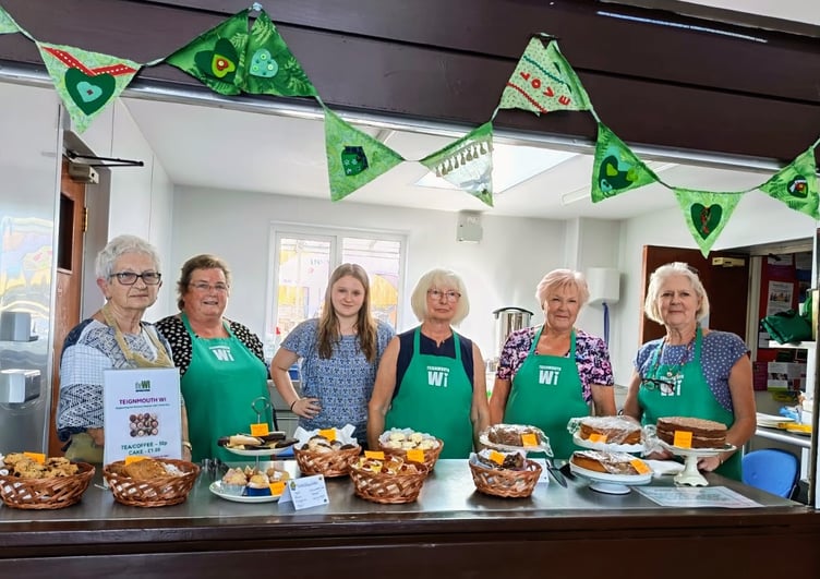 Teignmouth WI president Joanna Williams, far right, with members Pat Woolnough, Chris Jones, Sylvia Price, and a young visitor to the branch