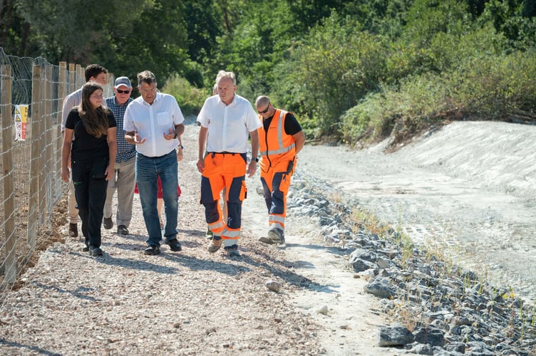 Sibelco engineers, members of Stover Canal society, MP Martin Wrigley and Environment Agency staff on the newly reopened path. Photo Sibelco
