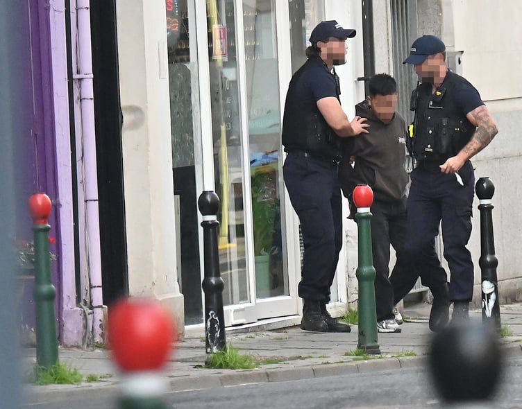 Immigration Enforcement officers detain a suspect in Union Street, Newton Abbot